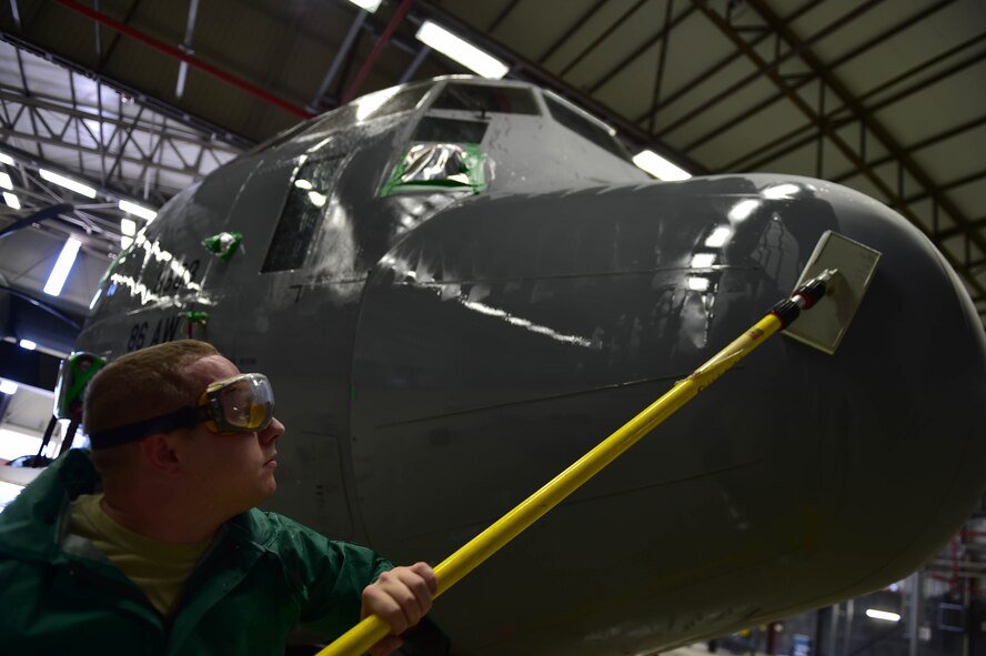 Staff Sgt. Nathan Baker, 86th Aircraft Maintenance Squadron aircraft hydraulics craftsman, washes the nose of a C-130J Super Hercules April 20, 2015, at Ramstein Air Base, Germany. All C-130Js at Ramstein are washed regularly for corrosion prevention and control. Keeping major structural components clean helps improve the life span of aircraft, thus keeping them operational for longer. (U.S. Air Force photo/Staff Sgt. Sara Keller)