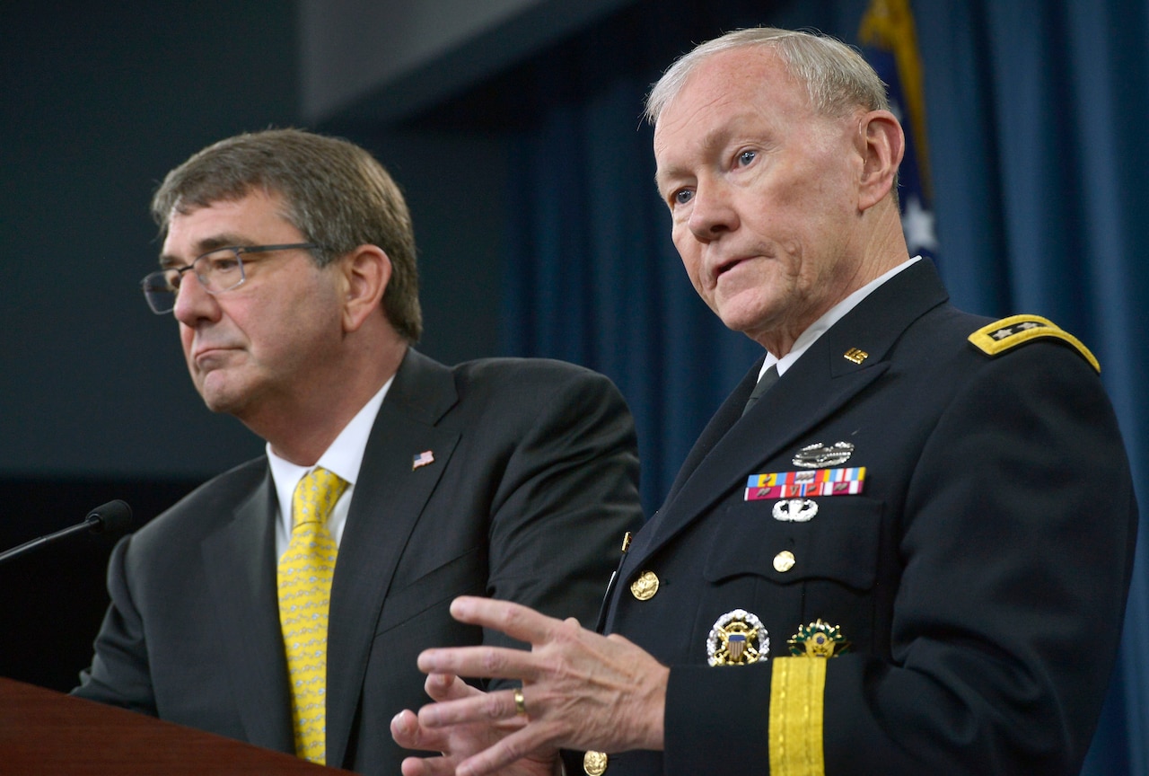 Chairman of the Joint Chiefs of Staff Gen. Martin E. Dempsey answers a reporter's questions as Defense Secretary Ash Carter listens during a press conference in the Pentagon Briefing Room May 7, 2015. DoD Photo by Glenn Fawcett