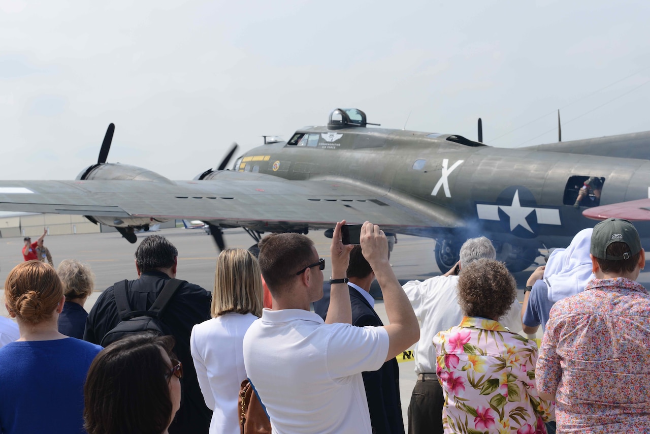 A crowd gathers on the tarmac to watch World War II-era bombers warm up their engines for a test flight on May 7, 2015, at the Manassas Regional Airport in Virginia in support of the May 8 Arsenal of Democracy Flyover. The flyover will commemorate the 70th anniversary of the allied victory in Europe, sending 56 vintage military aircraft over the National Mall in Washington, D.C. U.S. Army photo by Jacqueline M. Hames