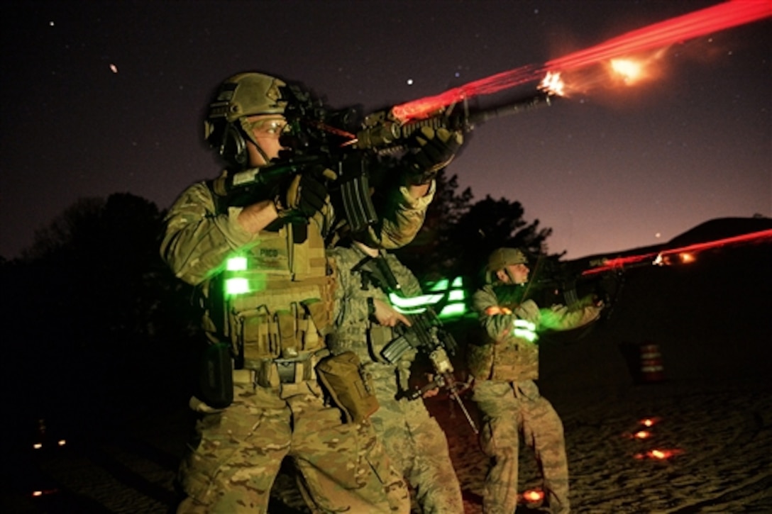 Air National Guard Staff Sgt. Joseph Pico fires during night training at the Suffolk County Police Range in Westhampton Beach, N.Y., May 7, 2015. Pico is assigned to the 106th Rescue Wing. 