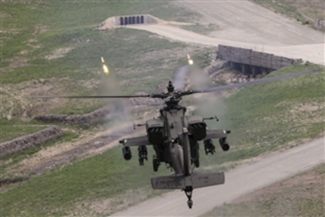 A U.S. Army AH-64 Apache fires point detonation rounds during a training exercise in South Korea, May 6, 2015. The Apache is assigned to the 2nd Combat Aviation Brigade.