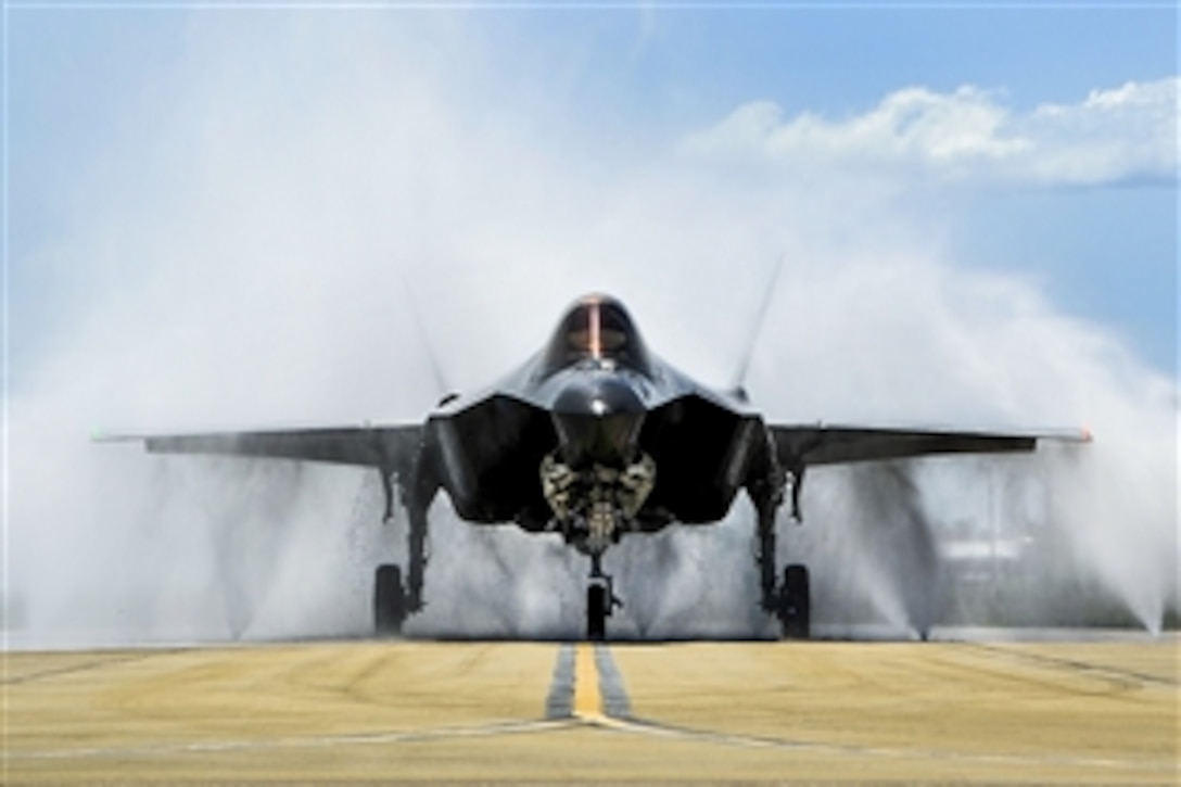 Air Force Lt. Col. Christine Mau navigates her F-35A through a wash rack on Eglin Air Force Base, Fla., May 5, 2015, after returning from her first flight. Mau, the deputy commander of the 33rd Operations Group, is the first female pilot in the F-35 program.