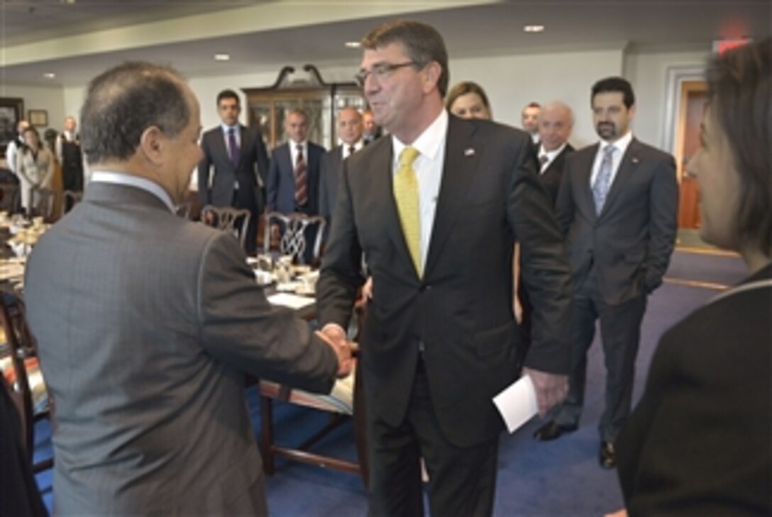 U.S. Defense Secretary Ash Carter, right, shakes hands with Kurdistan Regional President Masoud Barzani as they prepare to meet at the Pentagon, May 7, 2015, to discuss matters of mutual interest. Barzani is on a weeklong visit to the United States to meet with senior officials. 