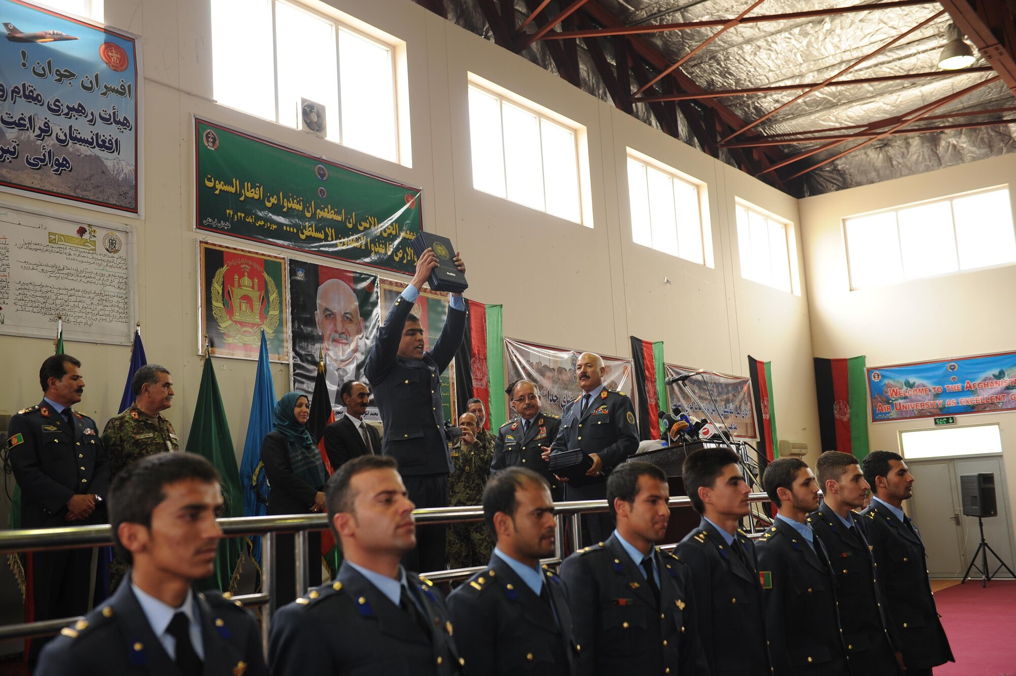 A recent graduate of the Afghan Air Force academy exclaims his allegiance to Afghanistan during a graduation ceremony, May 7, 2015. He was one of 184 newly commissioned second lieutenants in the Afghan Air Force. (Official U.S. Air Force photo/Capt. Jeff M. Nagan)