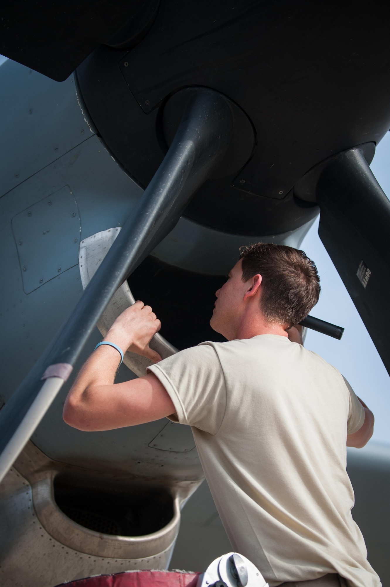 U.S. Air Force Staff Sgt. Jordan Scott, assigned to the 455th Expeditionary Aircraft Maintenance Squadron, checks the engine on a C-130J Super Hercules aircraft during a post flight inspection on the flight line at Bagram Airfield, Afghanistan, May 5, 2015.  The 455th EAMXS ensure Super Hercules on Bagram are prepared for flight and return them to a mission-ready state once they land. (U.S. Air Force photo by Tech. Sgt. Joseph Swafford/Released)