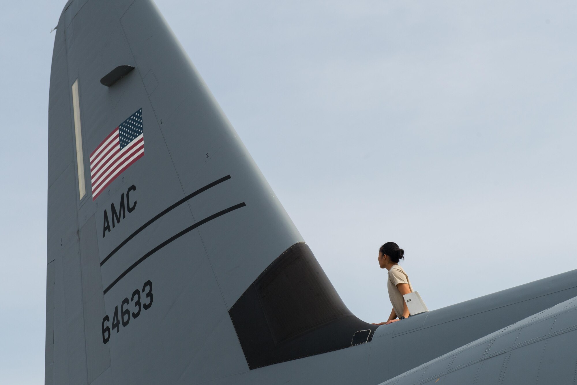 U.S. Air Force Senior Airman Mina Phouangphidok, assigned to the 455th Expeditionary Aircraft Maintenance Squadron, inspects the tail section on a C-130J Super Hercules aircraft during a post flight inspection on the flight line at Bagram Airfield, Afghanistan, May 5, 2015.  The 455th EAMXS ensure Super Hercules on Bagram are prepared for flight and return them to a mission-ready state once they land.  (U.S. Air Force photo by Tech. Sgt. Joseph Swafford/Released)