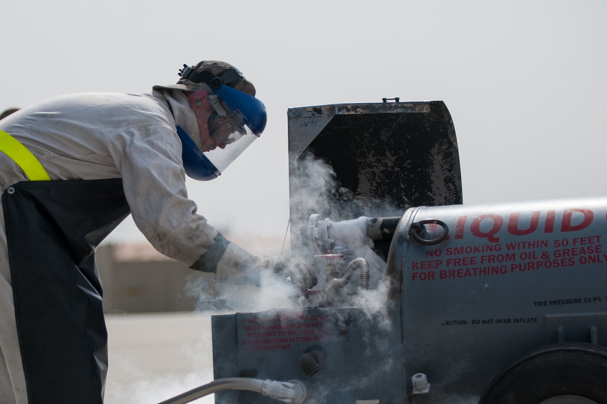 U.S. Air Force Airman 1st Class Ryan Munchel, assigned to the 455th Expeditionary Aircraft Maintenance Squadron, transfers liquid oxygen to an LOX reservoir in a C-130J Super Hercules aircraft on the flight line at Bagram Airfield, Afghanistan, May 5, 2015.  The 455th EAMXS ensure Super Hercules on Bagram are prepared for flight and return them to a mission-ready state once they land. (U.S. Air Force photo by Tech. Sgt. Joseph Swafford/Released)