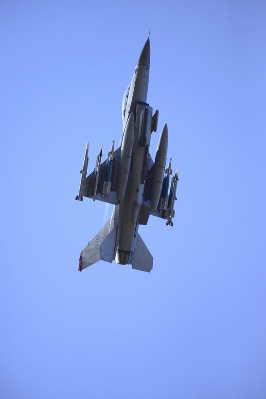 An F-16 Fighting Falcon assigned to the 13th Fighter Squadron at Misawa Air Base, Japan, launches for a training sortie May 6, 2015, during Red Flag-Alaska 15-2 at Eielson Air Force Base, Alaska. The exercise enables units from around the globe to conduct live-fire training, utilizing more than 67,000 square miles of airspace over the Joint Pacific Alaska Range Complex. (U.S. Air Force photo/Senior Airman Peter Reft)