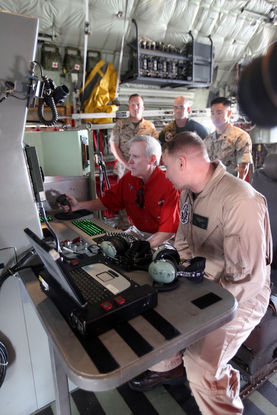 Secretary of the Navy Ray Mabus, left, sits beside Maj. Ryan C. Pope in the control seat of a KC-130J Super Hercules as he receives a guided tour of the flight line during a visit to Marine Corps Air Station Cherry Point, North Carolina, May 6, 2015. Pope is the executive officer of Marine Aerial Refueler Transport Squadron 252.