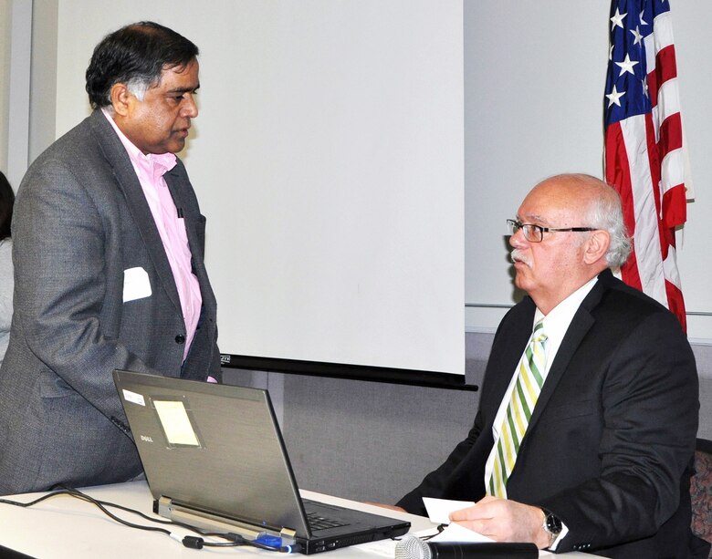 Gregory Cuyjet, (at right) the Army Corps’ New York District Deputy for Small Business speaks with an individual about the federal contracting process. 