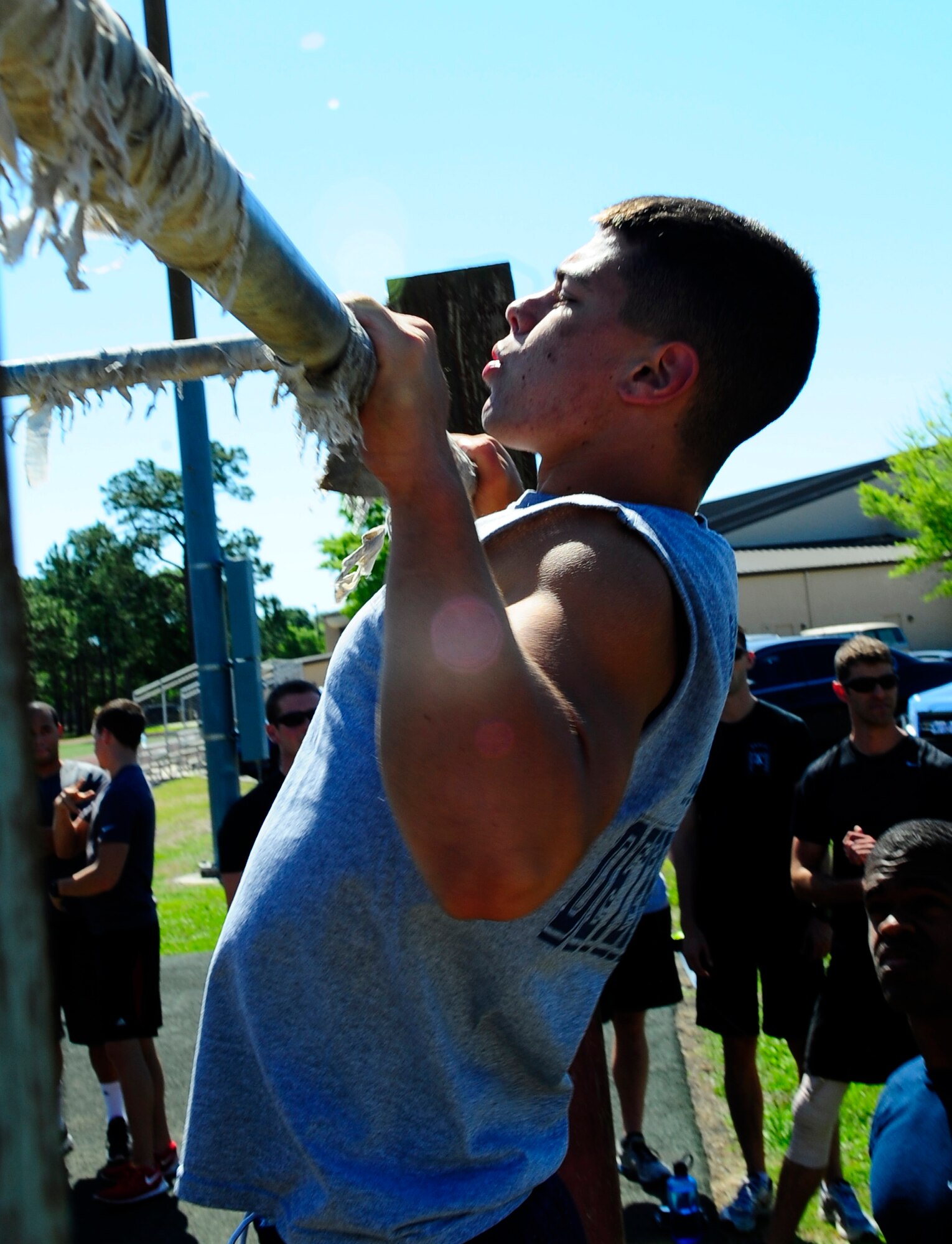 Staff Sgt. Jeoffrey Ilgenfritz, 1st Special Operations Component Maintenance Squadron hydraulics systems craftsman, does pull ups for Hurlburt Field’s fitness day at Hurlburt Field, Fla., May 6, 2015. Air Force Fitness Month promotes physical wellness and teaches Airmen how being "fit" plays a vital role in the quality of military life. (U.S. Air Force photo/Airman 1st Class Andrea Posey)