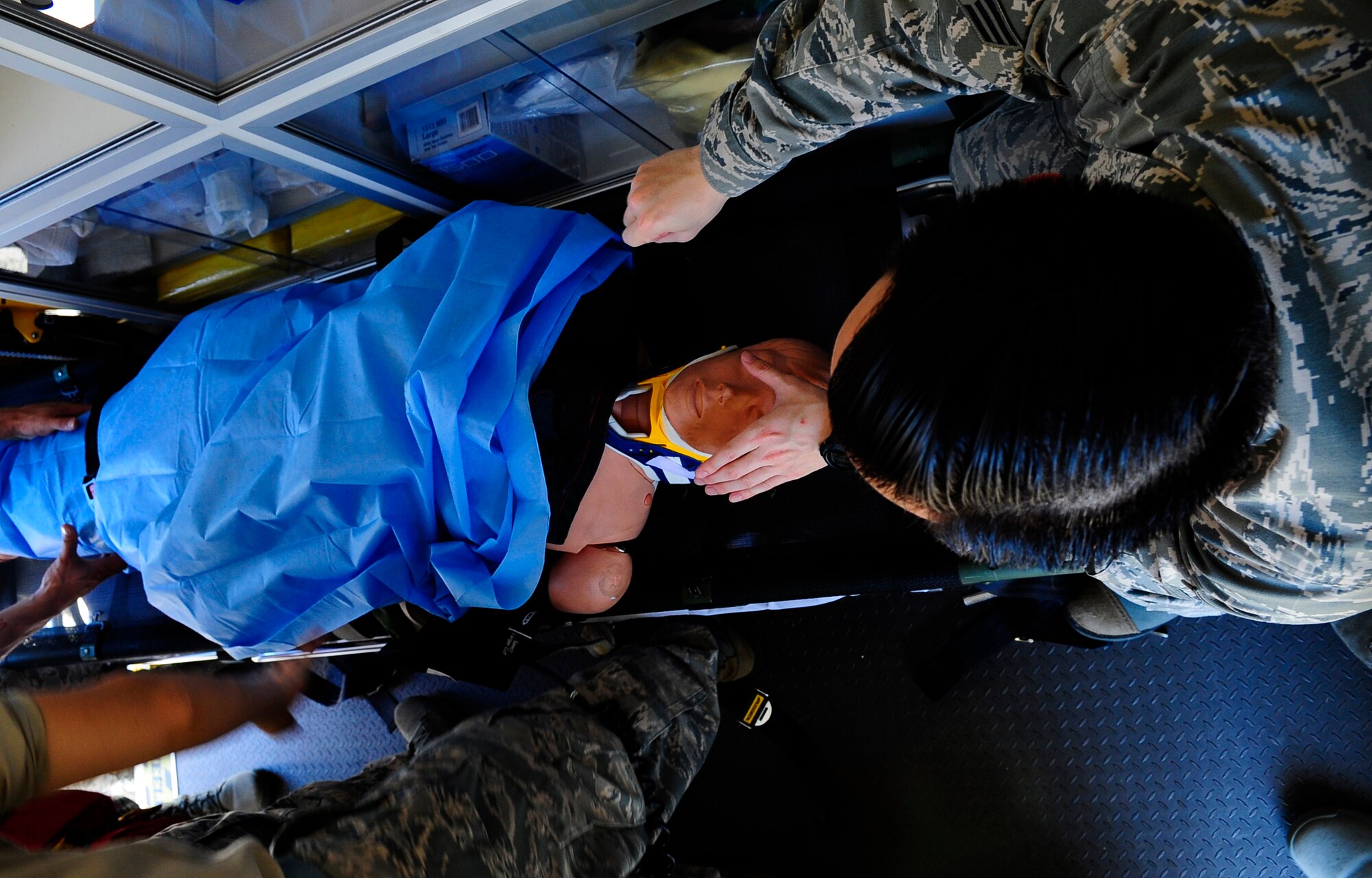 Senior Airman Bob Keophakdy, 1st Special Operations Medical Operations Squadron aerospace medical technician, reassures a simulated crash victim at Hurlburt Field, Fla., May 6, 2015. The 1 SOMDOS promotes and maintains the health of approximately 8,900 base personnel to ensure a vital and fit force, deployable to any location. (U.S. Air Force photo/Airman 1st Class Andrea Posey)