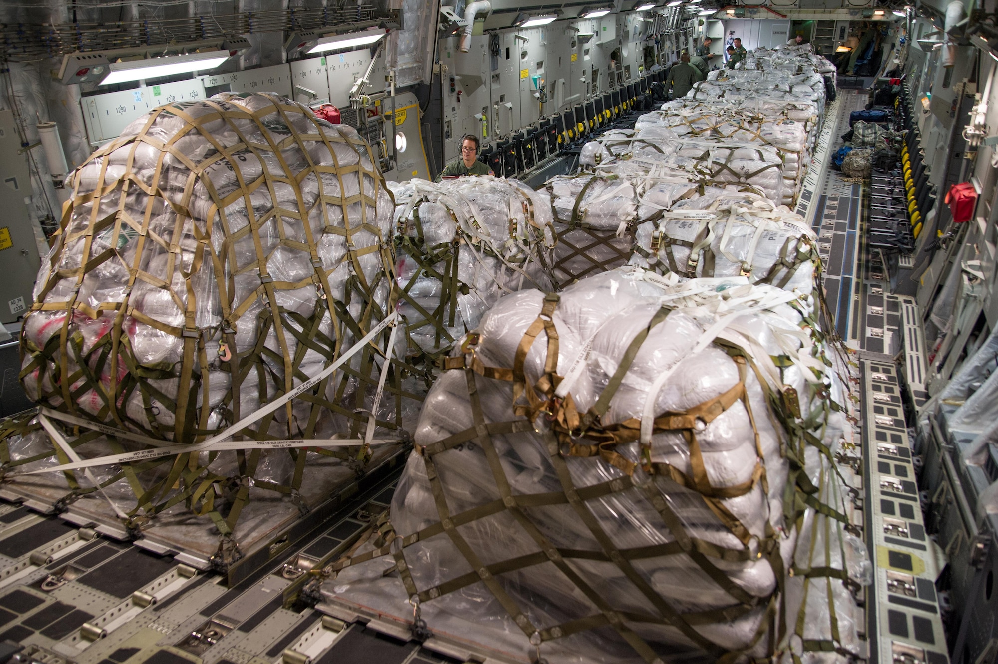 The cargo compartment of a C-17 Globemaster III is loaded with thirteen pallets of food totaling more than 91,000 pounds April 23, 2015, as it prepares to depart to Haiti during a four-day training mission to Key West Naval Air Station, Fla. from Joint Base Charleston, S.C. The 315th AW flew 20 sorties during the deployment and airlifted more than 345,000 pounds of humanitarian cargo, which included 61 pallets of food and clothing and one school bus. (U.S. Air Force Photo by Tech. Sgt. Shane Ellis)