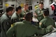 Master Sgt. Ken Hundemer discusses security operations, April 23, 2015 with members of the 315th Security Forces Squadron while on a training mission to Haiti during a four-day training mission to Key West Naval Air Station, Fla. The 315th Airlift Wing flew 20 sorties during the four-day deployment and airlifted more than 345,000 pounds of humanitarian cargo, which included 61 pallets of food and clothing and one school bus. Hundemer is a loadmaster assigned to the 317th Airlift Squadron, and he also serves as the Denton Program director of operations in his civilian capacity. (U.S. Air Force Photo by Tech. Sgt. Shane Ellis)