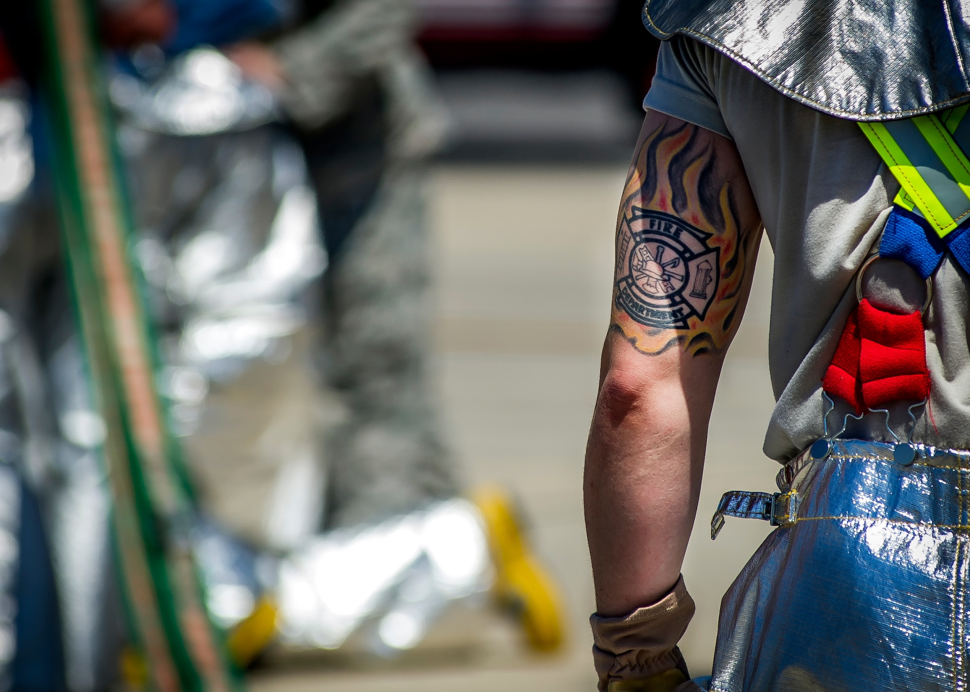 Staff Sgt. Samuel Potts, 315th Civil Engineering Flight firefighter, aids other members bringing the dry hose in after flight line training May 2, 2015, at Joint Base Charleston – Air Base, S.C. The flight line training was done with a dry hose and tested the members response time and ability to rescue crew members in the event of an emergency. (U.S. Air Force photo / Senior Airman Tom Brading)