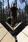 Marine Corps Officer candidates and applicants work together to complete a Leadership Reaction Course at Fort McCoy, Wis., May 2, 2015.  Recruiting Stations Milwaukee and Twin Cities conducted a joint weekend event to prepare the candidates for Officer Candidates School.  