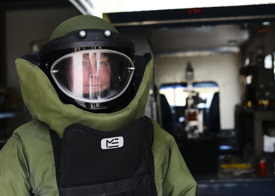 Tech. Sgt. Lawrence Miller, the 31st Civil Engineer Squadron explosive ordnance disposal training NCO in charge, dons an EOD 9 Bomb Suit April 22, 2015, at Aviano Air Base, Italy. The suit consists of numerous layers of Kevlar, plastic and foam that protect the wearer’s organs and prevent any spinal damage from the force of the blast. (U.S. Air Force photo/Senior Airman Austin Harvill)