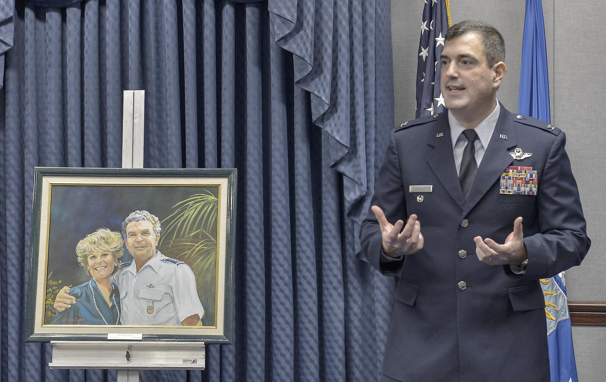 Col. Mark August speaks the audience in the Pentagon during the 2014 General and Mrs. Jerome F. O'Malley Award ceremony May 8, 2015, in Washington. Air Force Chief of Staff Gen. Mark A. Welsh III presented Col. and Mrs. August with the award recognizing a wing commander and spouse team whose contributions to the nation, Air Force, and local community best exemplified the highest ideals and positive leadership of a military couple in a key Air Force position. Col. and Mrs. August received the award for their time as the commander and spouse at the 374th Airlift Wing, Yokota Air Base, Japan.  (U.S. Air Force Photo/Michael J. Pausic)