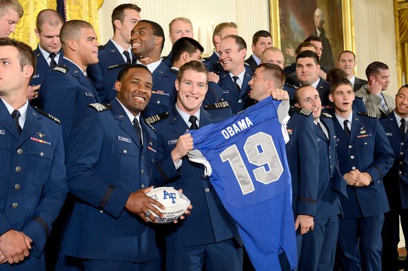 Members of the U.S. Air Force Academy football team stand with the jersey and football they intend to present to President Barack Obama during his presentation of the Commander-in-Chief's Trophy to the Academy at the White House May 7, 2015.  Obama congratulated the team, along with Lt. Gen. Michelle D. Johnson, the superintendent of the Academy, and Air Force Chief of Staff Gen. Mark A. Welsh III. (U.S. Air Force photo/Scott M. Ash)   
