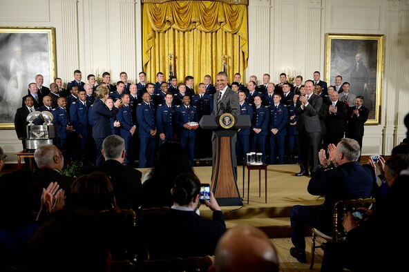 President Barack Obama congratulates the U.S. Air Force Academy football team with the Commander-in-Chief's Trophy at the White House May 7, 2015. With the team were Lt. Gen. Michelle D. Johnson, the superintendent of the Academy, and Air Force Chief of Staff Gen. Mark A. Welsh III. (U.S. Air Force photo/Scott M. Ash)