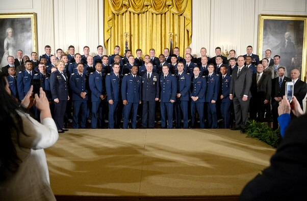 Air Force Chief of Staff Gen. Mark A. Welsh III, center, stands with Lt. Gen. Michelle D. Johnson, superintendent of the U.S. Air Force Academy, and Academy head football coach Troy Calhoun, after the team received the Commander-in-Chief's trophy from President Barack Obama at the White House May, 7, 2015. (U.S. Air Force photo/Scott M. Ash)   