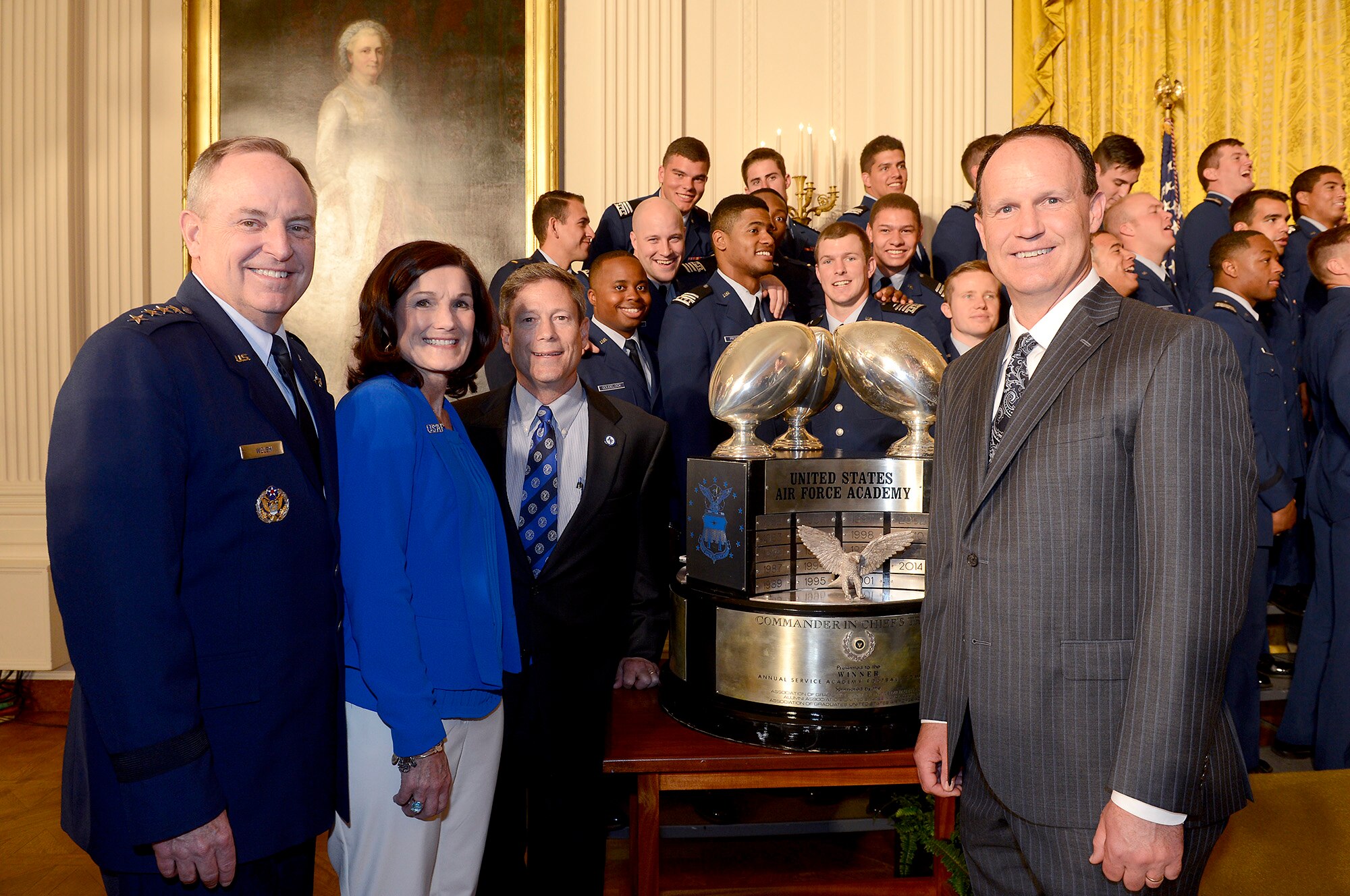 Air Force Chief of Staff Gen. Mark A. Welsh III, his wife, Betty, James Nolton, the U.S. Air Force Academy athletics director, and Troy Calhoun, the Academy's head football coach, pose with the Commander-in-Chief's Trophy, earned by the Academy football team, following a ceremony at the White House May 7, 2015. (U.S. Air Force photo/Scott M. Ash)   