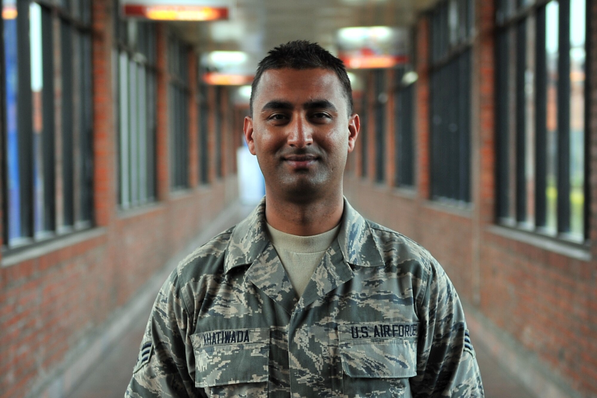 U.S. Air Force Senior Airman Manoj Khatiwada, 21st Medical Operations Squadron aerospace medical technician, stands in the terminal at the Tribhuvan International Airport in Kathmandu, Nepal, May 8, 2015. Manoj joined a team from the 36th Contingency Response Group to assist U.S. Air Force, U.S. Department of State and U.S. Agency for International Development operations by assisting with communicating with the Nepalese Army as they process relief supplies following a magnitude 7.8 earthquake that struck the region April 25, 2015. (U.S. Air Force photo by Staff Sgt. Melissa White/Released)