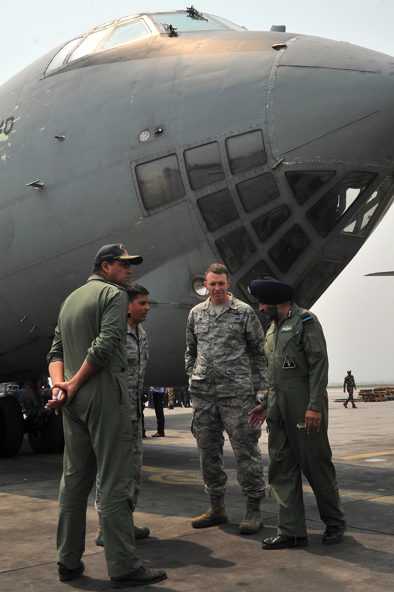 U.S. Air Force Col. Lee Anderson, 36th Contingency Response Group commander, talks with Indian air force leadership after they delivered relief supplies on their IL-76 cargo aircraft May 7, 2015, at the Tribhuvan International Airport in Kathmandu, Nepal. The Nepalese Army and Airmen worked with military members from the Bangladesh air force and Indian air force to process cargo from their aircraft arriving in Nepal to provide disaster relief following a magnitude 7.8 earthquake that struck the nation April 25.  (U.S. Air Force photo by Staff Sgt. Melissa White/Released)