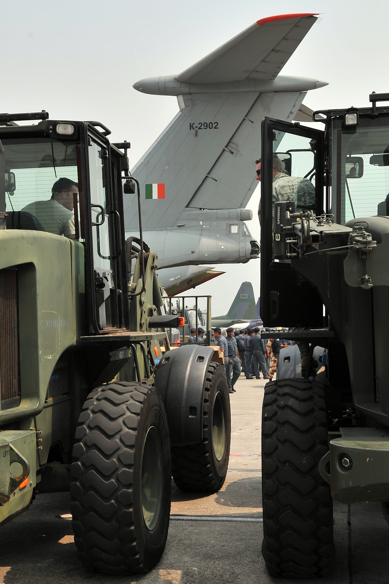 36th Contingency Response Group Airmen prepare to process relief supplies from an Indian air force IL-76 cargo aircraft May 7, 2015, at the Tribhuvan International Airport in Kathmandu, Nepal. The Nepalese Army and Airmen worked with military members from the Bangladesh air force and Indian air force to process cargo from their aircraft arriving in Nepal to provide disaster relief following a magnitude 7.8 earthquake that struck the nation April 25. (U.S. Air Force photo by Staff Sgt. Melissa White/Released)