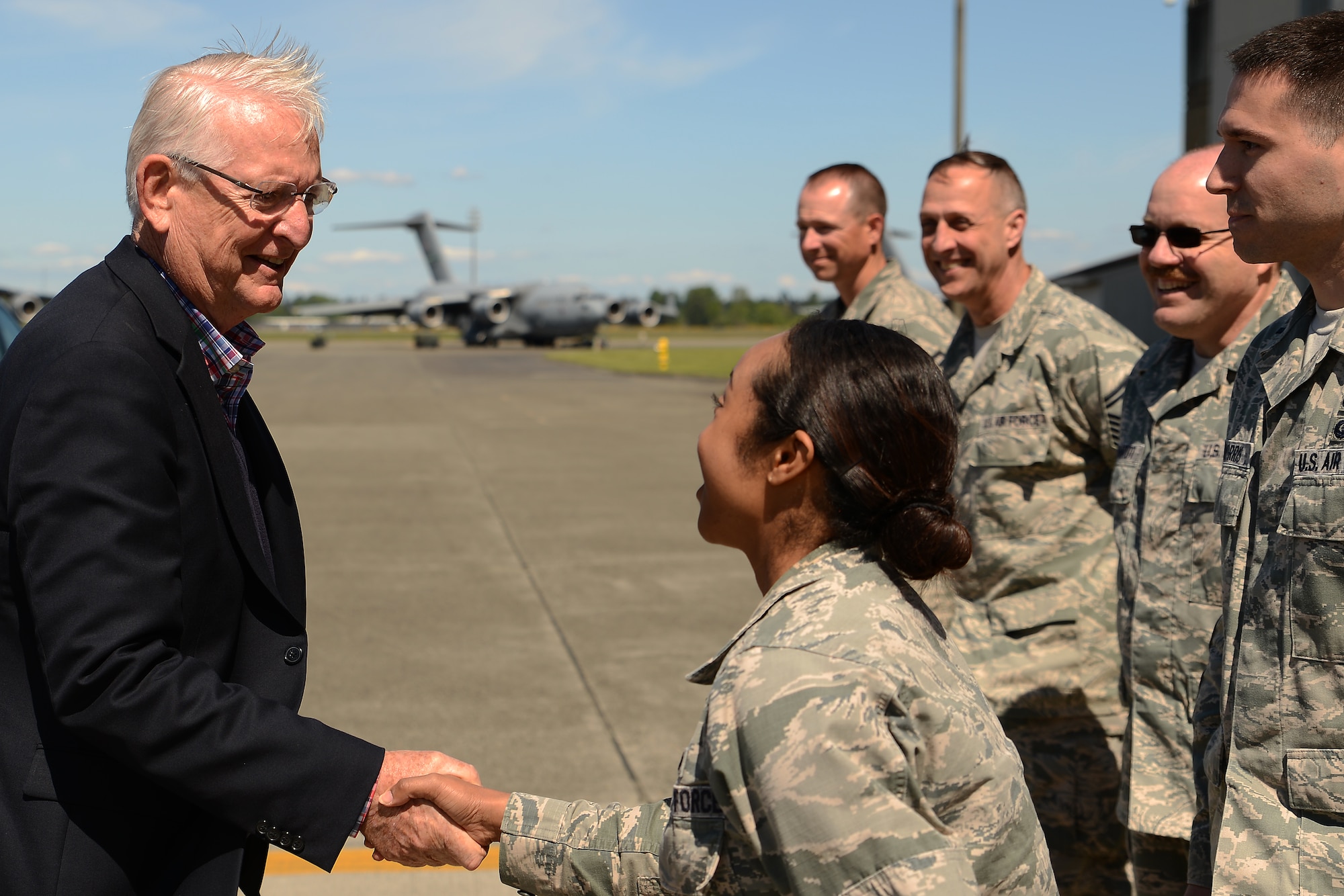 Capt. Abigail Stewart, 62nd Maintenance Group operations officer, greets Richard Murrell, Tropical Shipping chief executive officer, May 7, 2015, at Joint Base Lewis-McChord, Wash. Murrell was on a Business Executives for National Security tour of JBLM. (U.S. Air Force photo\Staff Sgt. Tim Chacon)