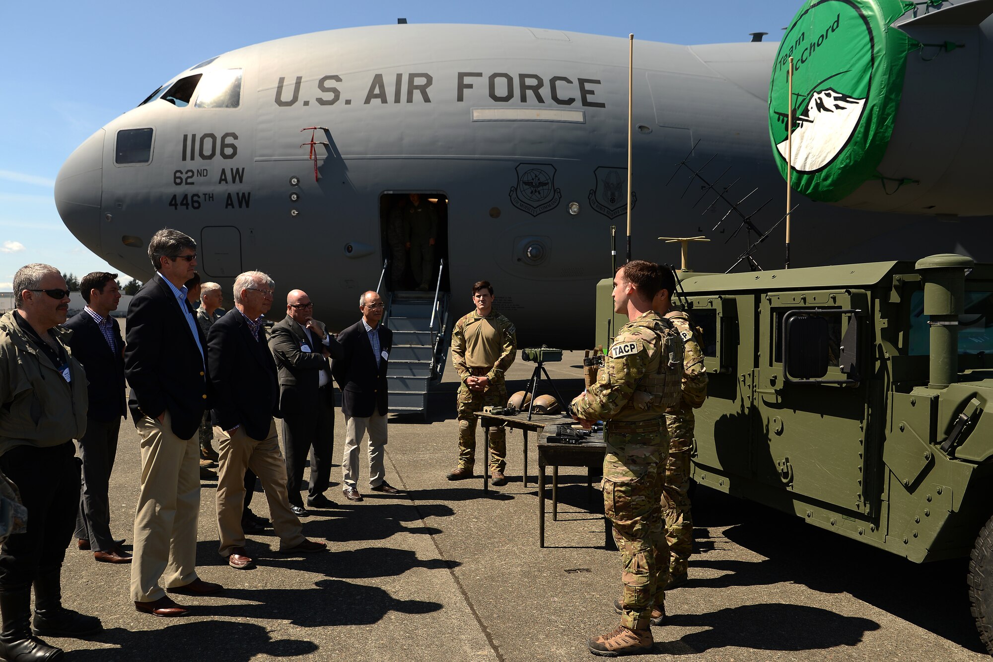 Airmen from the 22nd Special Tactics Squadron explain their duties to members of the Business Executives for National Security May 7, 2015, at Joint Base Lewis-McChord, Wash. The Airmen explained the duties of a Tactical Air Control Party and displayed some of the tools of the trade. (U.S. Air Force photo\Staff Sgt. Tim Chacon)