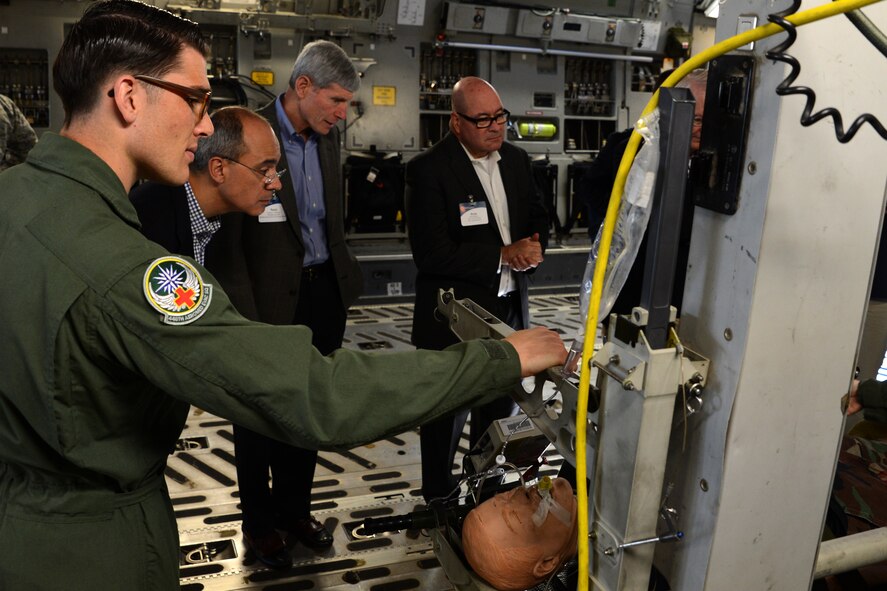 Senior Airman Garret Plessner, 446th Airlift Wing aeromedical technician, briefs members of the Business Executives for National Security on the 446th AW aeromedical evacuation mission May 7, 2015, at Joint Base Lewis-McChord, Wash. Plessner showed how the C-17 Globemaster III is well suited their mission. (U.S. Air Force photo\Staff Sgt. Tim Chacon)