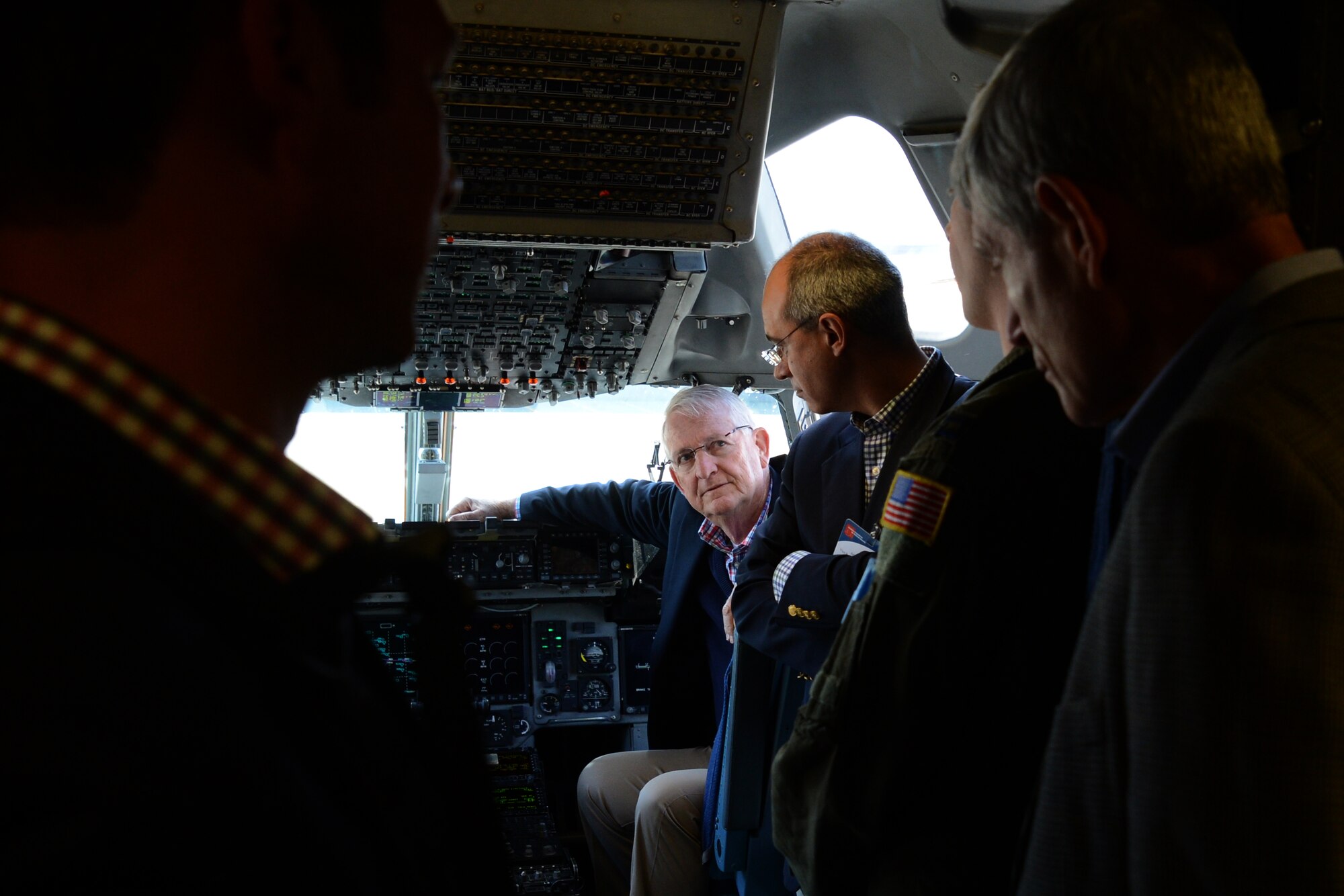 Richard Murrell (center), Tropical Shipping chief executive officer, asks questions about the C-17 Globemaster III May 7, 2015, at Joint Base Lewis-McChord, Wash. Murrell was part of a Business Executives for National Security tour that visited JBLM. (U.S. Air Force photo\Staff Sgt. Tim Chacon)