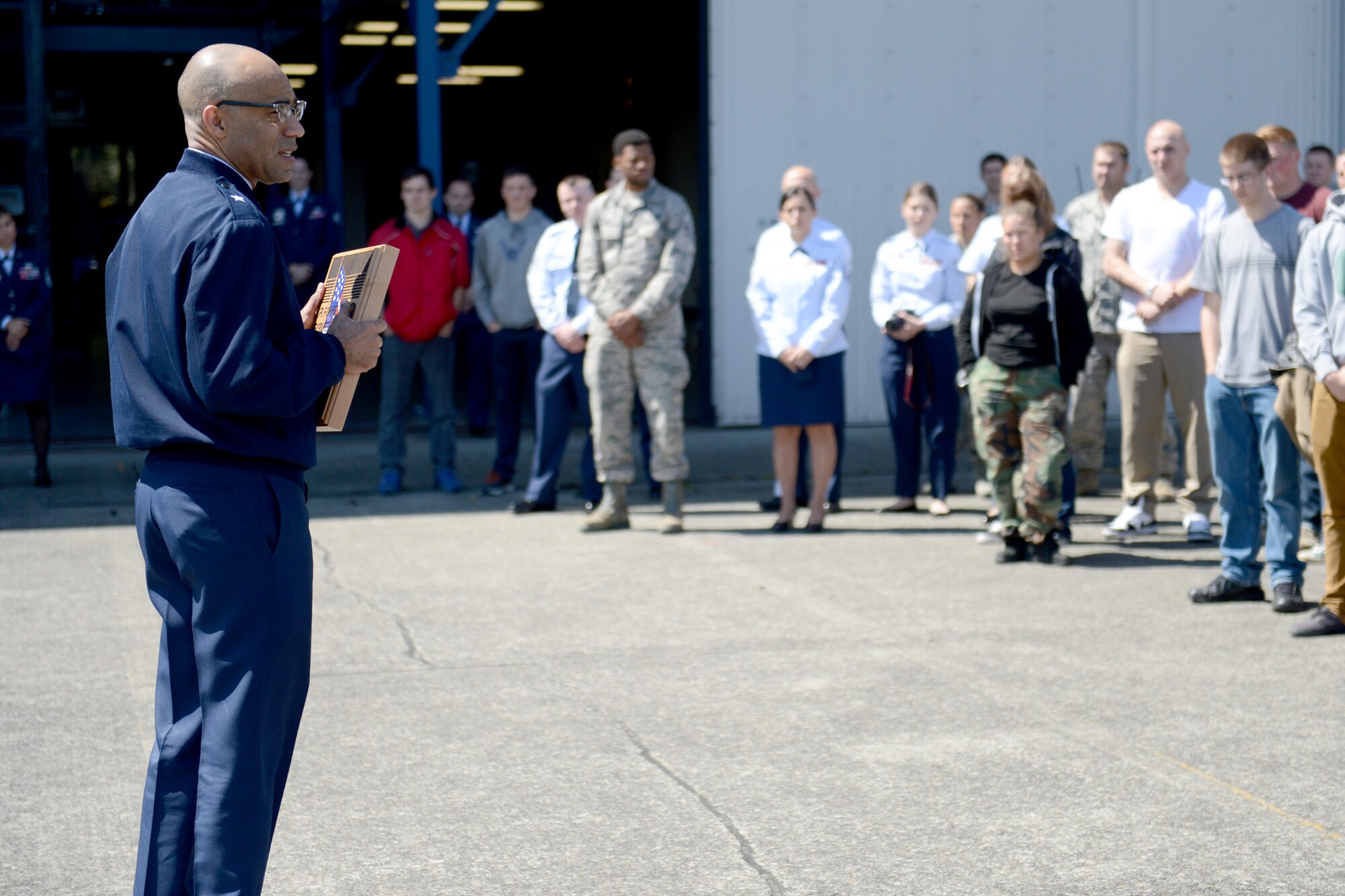 Brig. Gen. James Johnson, Air Force Recruiting Service commander, talks to Airmen and delayed entry program candidates May 7, 2015, at Joint Base Lewis-McChord, Wash. Johnson talked about the dedication and efforts of Airmen and the future of the Air Force and recruiting. (U.S. Air Force photo/Airman 1st Class Keoni Chavarria)