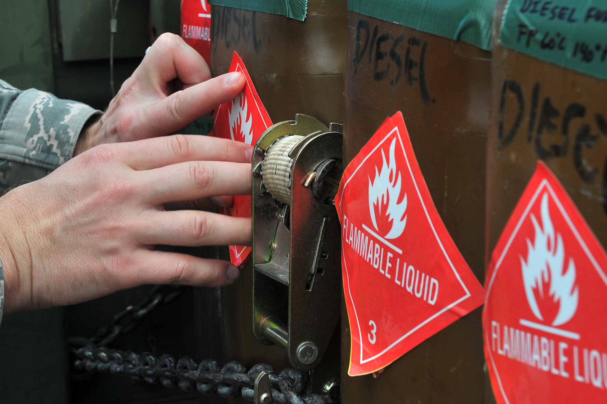 U.S. Air Force Tech. Sgt. Eric Morris, 36th Mobility Response Squadron ramp coordinator, labels fuel containers during cargo processing May 1, 2015, at Andersen Air Force Base, Guam, in preparation for deployment to Nepal. The 36th Contingency Response Group is a rapid-deployment unit designed to establish and maintain airfield operations and will join U.S. Department of State and U.S. Agency for International Development led humanitarian and disaster relief operations in support of the Government and Armed Forces of Nepal.  (U.S. Air Force photo by Staff Sgt. Melissa White/Released)