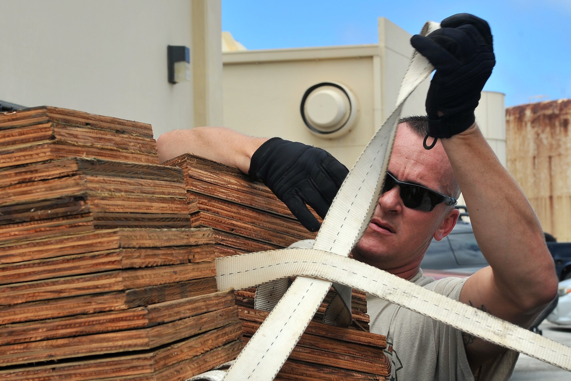 U.S. Air Force Tech. Sgt. Randy Walgren, 36th Mobility Response Squadron NCO in charge of aerial operations, ties down shoring blocks, which are used to protect equipment and the aircraft during transport, May 1, 2015, at Andersen Air Force Base, Guam, in preparation for deployment to Nepal. Walgren and his unit the 36th Contingency Response Group will join U.S. Department of State and U.S. Agency for International Development led humanitarian and disaster relief operations in support of the Government and Armed Forces of Nepal.  (U.S. Air Force photo by Staff Sgt. Melissa White/Released)