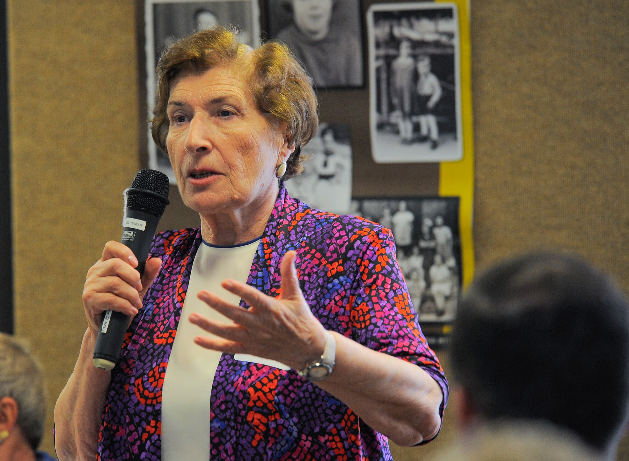 Yulia Genina, Holocaust survivor, shares her story of survival with an audience during the Holocaust Day of Remembrance at Davis-Monthan Air Force Base, Ariz., May 7, 2015. Genina shared the story of when her family was forced from their home when she was a young girl. 