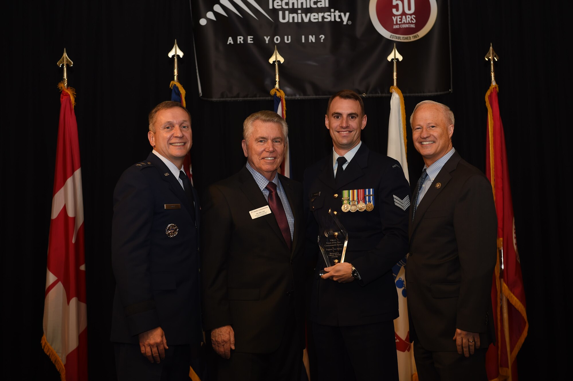 Sergeant Dan Hickey poses for a picture after winning the Commonwealth
Partners Military Person of the Year award at the 39th Annual Armed Forces
Recognition Luncheon May 8, 2015, at the Doubletree Stapleton Hotel,
Denver. The AFRL, hosted by the Aurora Chamber of Commerce, recognized
outstanding local military leaders from all branches of service. (U.S. Air
Force photo by Airman 1st Class Samantha Meadors/Released)
