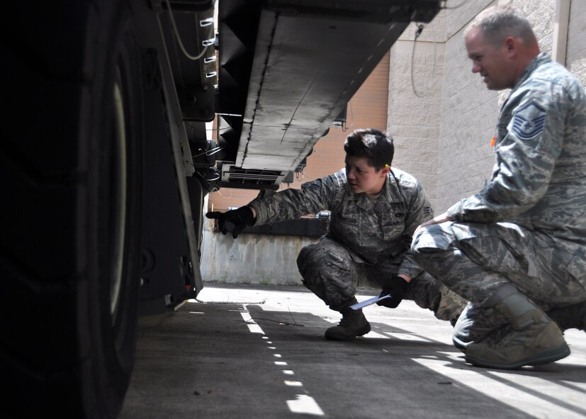 Senior Airman Claire Requiroso, 67th Aerial Port Squadron, asks for clarification on a piece of equipment as she double-checks operability, from her supervisor, Master Sgt. Doane Kaiser. The 67th APS spent two weeks at Hurlburt Field, Fla., as part of their annual training, where they were able to work with aircraft and vehicles they don’t normally have access to at Hill Air Force Base. (U.S. Air Force photo/Staff Sgt. Crystal Charriere)