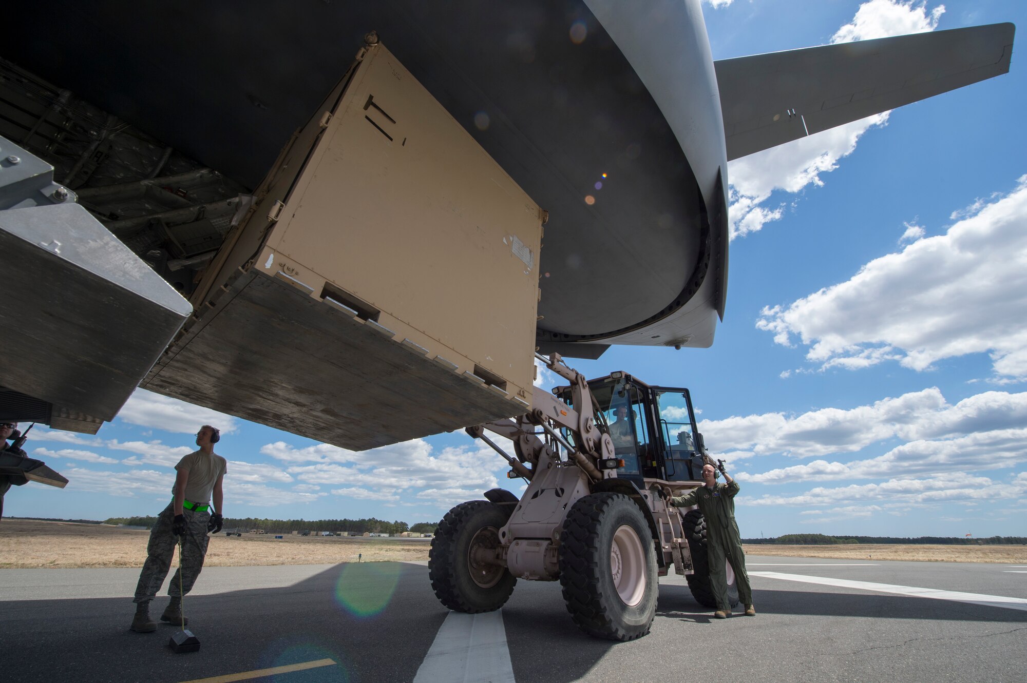 Airmen from the 621st Contingency Response Wing load equipment onto a U.S. Air Force Globemaster III C-17 during an exercise at Joint Base McGuire-Dix-Lakehurst, N.J., April 29. The exercise helped train the crew members from five C-17’s, conducted engine running offloads, communication proficiency training, night vision goggle training, and a ramp coordinator chief received upgraded training during this exercise. (U.S. Air Force photo/Staff Sgt. Gustavo Gonzalez)