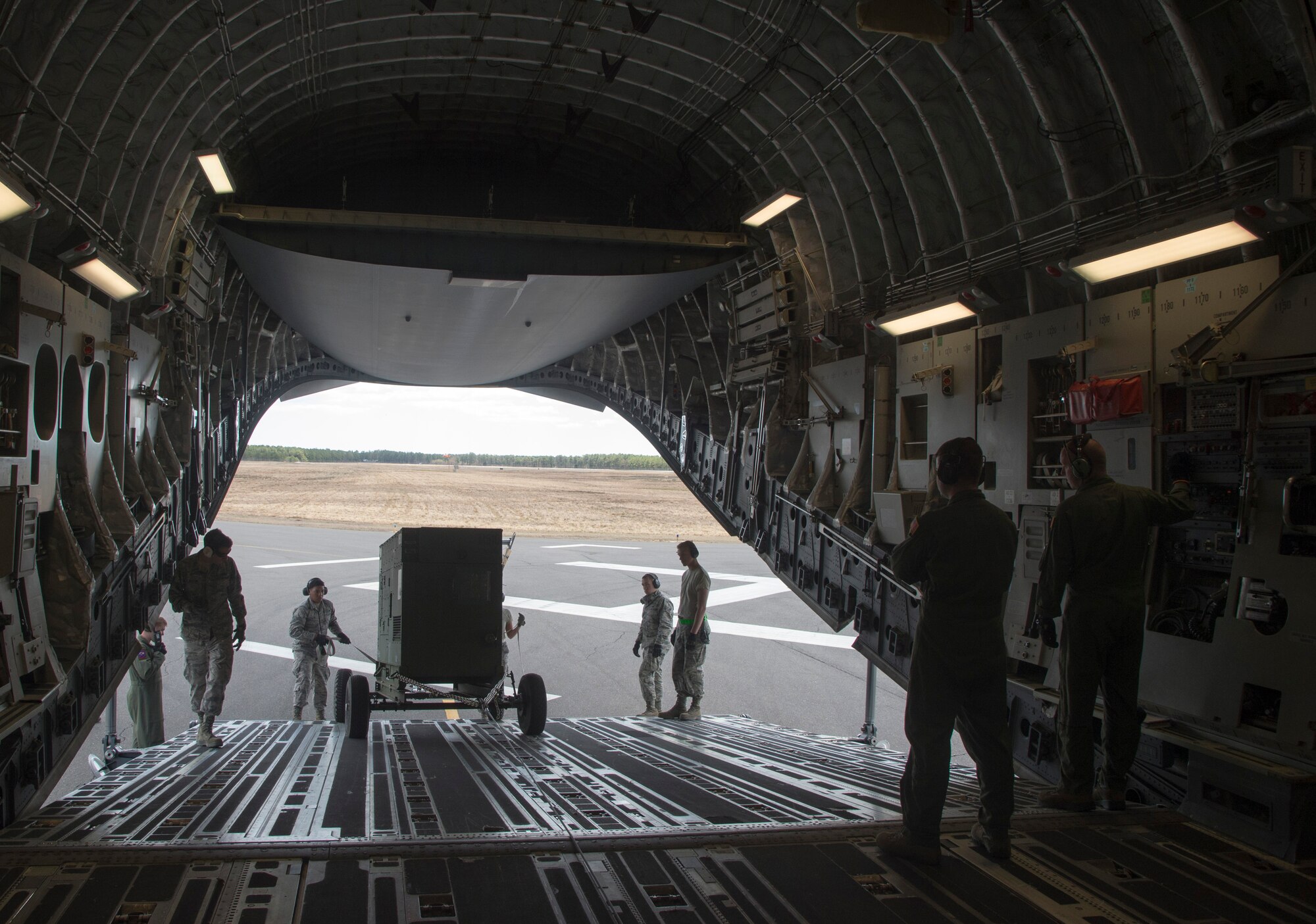 Airmen from the 621st Contingency Response Wing load equipment onto a U.S. Air Force Globemaster III during an exercise at Joint Base McGuire-Dix-Lakehurst, N.J., April 29. The exercise helped train the crew members from five C-17’s, conducted engine running offloads, communication proficiency training, night vision goggle training, and a ramp coordinator chief received upgraded training during this exercise. (U.S. Air Force photo/Staff Sgt. Gustavo Gonzalez)