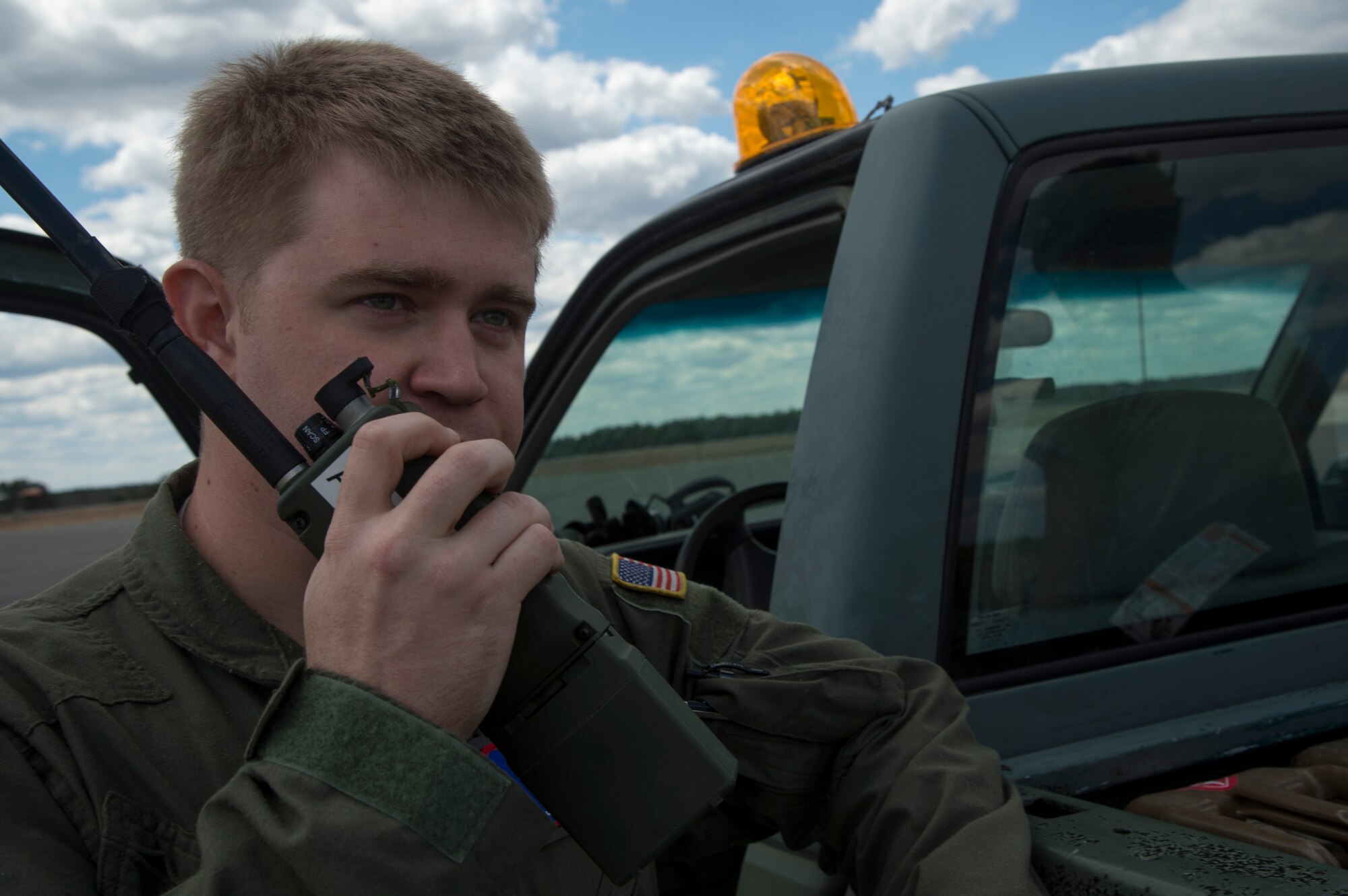Staff Sgt. John Hadden, 817 Global Mobility Squadron, talks into a radio during an exercise at Joint Base McGuire-Dix-Lakehurst, N.J., April 29. Approximately 28 Airmen from the 817th and 818th Contingency Response Groups supported the exercise with a contingency response team along with members of the 6th and 732nd Airlift Squadrons of Joint Base McGuire-Dix-Lakehurst, N.J., and the 3rd Airlift Squadron stationed at Dover Air Force Base, Del. (U.S. Air Force photo/Staff Sgt. Gustavo Gonzalez)