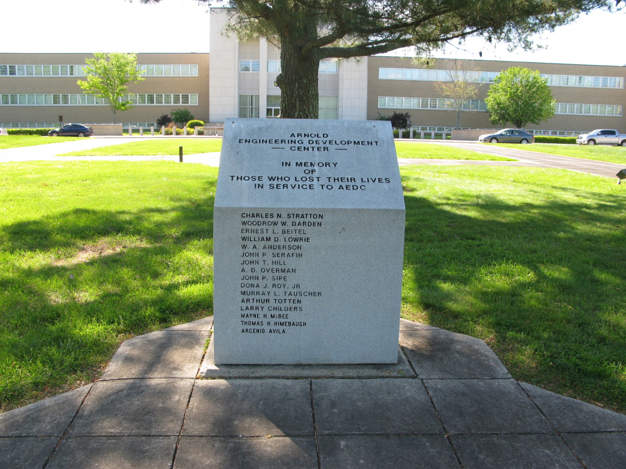 The AEDC Memorial Monument shown here in front of the Administration and Engineering (A&E) building lists AEDC personnel who lost their lives at the Complex in service to the nation. (Photo by Scott Nikodym)