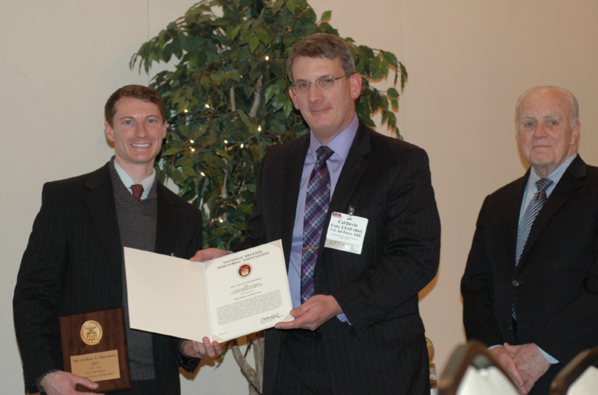 Joshua Hartman (left), an aeropropulsion test engineer with the AEDC Air Breathing Engine Test Branch, is presented the National Defense Industrial Association (NDIA) Air Force Civilian Tester of the Year award by Devin Cate, director of Test and Evaluation, U.S. Air Force. (Photo provided)
