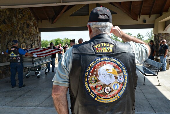 Members of the Patriot Guard Riders salute and show their respects during a flag folding ceremony at the Fort Sill National Cemetery May 4. (Air Force photo by Kelly White/Released)