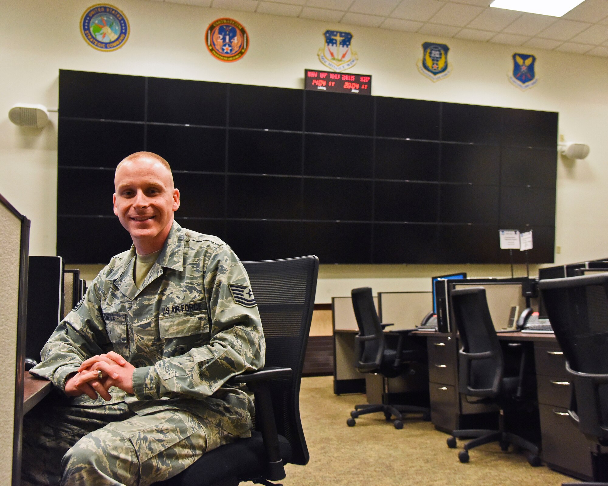 Tech. Sgt. Michael O’Neill, 341st Maintenance Operations Squadron missile maintenance operations center controller, poses for a photograph in Malmstrom Air Force Base’s Emergency Operations Center May 7. O’Neill is one of two Airmen from Malmstrom recently selected to attend Officer Training School this year. (U.S. Air Force photo/Airman 1st Class Collin Schmidt)