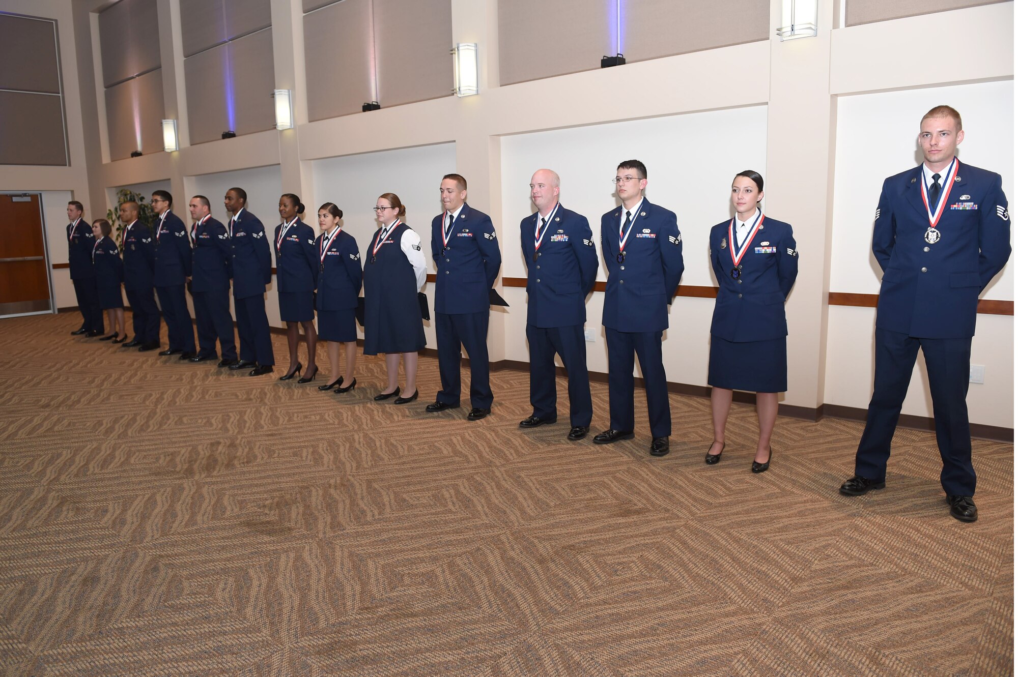 Buckley Airman Leadership School Class 15-D stands together after their graduation May 7, 2015, at the Leadership Development Center on Buckley Air Force Base, Colo. This graduation represents an important part of the enlisted force professional military education, teaching valuable skills required for supervisors. (U.S. Air Force photo by Airman 1st Class Samantha Meadors/Released)