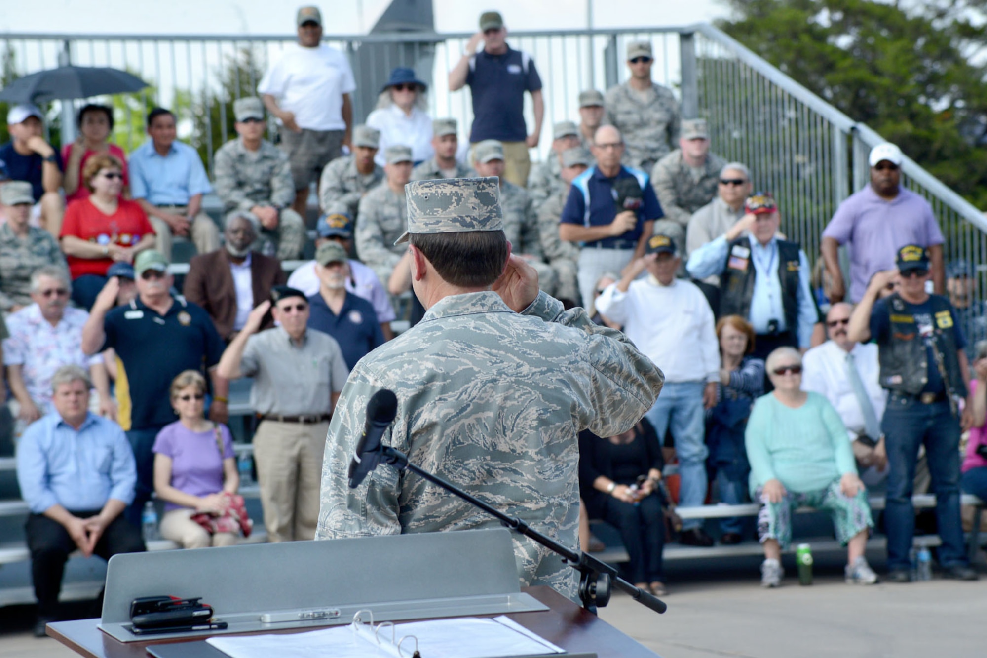 Air Force Sustainment Center Commander Lt. Gen. Bruce Litchfield salutes the veterans in attendance at the retreat ceremony commemorating the end of the Vietnam War 40 years ago. During the April 30 Back to Blue event, the general also thanked the veterans for their service. (Air Force photo by Kelly White/Released)