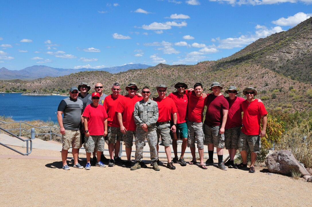 Col. Chris Triebel (left), 161st Air Refueling Wing vice commander, poses with the Aircrew Flight Equipment shop for a group photo after completing water survival training May 3, 2015, at Lake Pleasant, Peoria, Ariz. AFE is responsible for teaching the aircrew’s water survival refresher training every three years. (U.S. Air National Guard photo by Master Sgt. Kelly M. Deitloff)