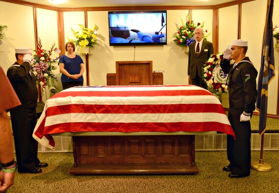 Members of the Navy Honor Guard salute during a funeral for Jerry Billings May 1. The Honor Guard also performed a flag folding ceremony during the service for the homeless veteran.